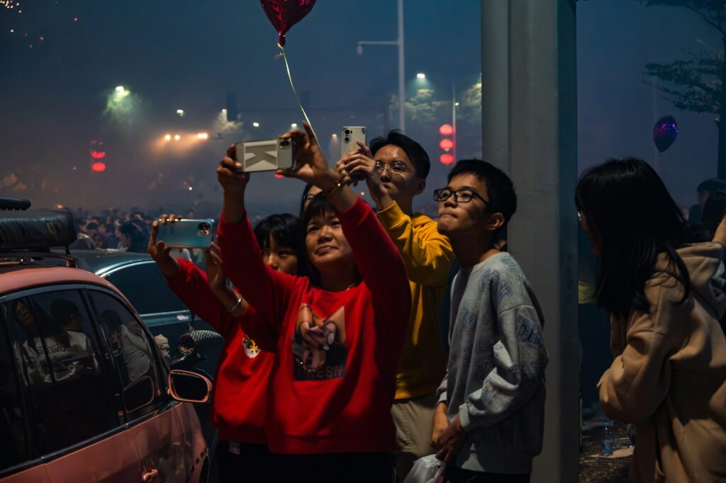 a group of people watching HBO Max Pakistan launching on mobile phone