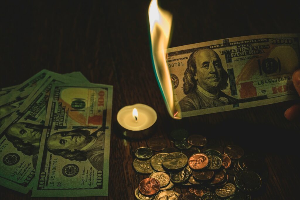 US dollar burning showing the importance of digital currencies